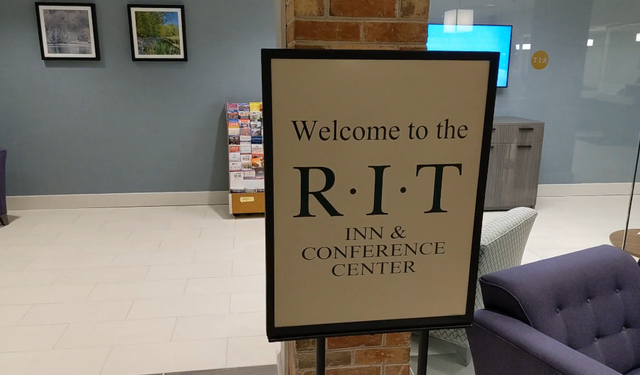 Sign that says "Welcome to the R.I.T. Inn & Conference Center".